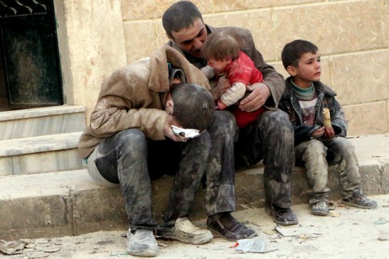 Syrian Family after the regime air bombed their home/<br /> Photo source:www.rookiestew.com