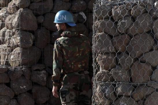 A UN peacekeeping soldier stands next to a shelter inside a UN base at the Golan Heights/ Photo source:www.thehindu.com